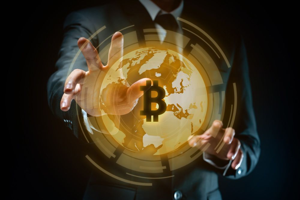 Businessman in black suit with bitcoin